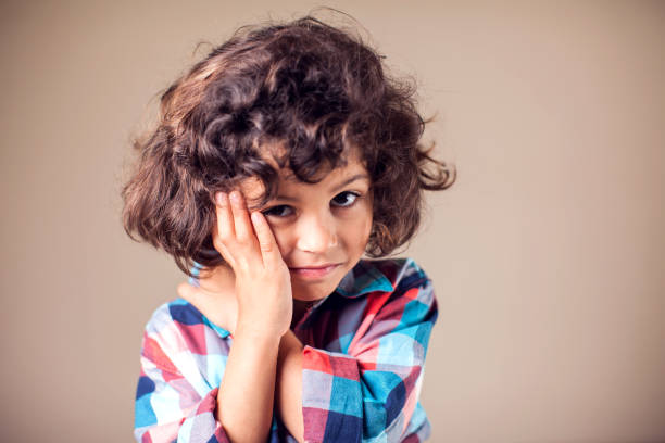 istock Child toothache. Closeup portrait boy with sensitive tooth ache. Negative human emotion, medicine and healthcare concept 1144763448