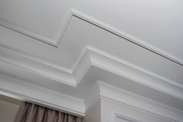 Detail of intricate corner crown molding.  a detail of corner ceiling. Detail of intricate corner crown molding.  a detail of corner ceiling. moulding trim photos stock pictures, royalty-free photos & images