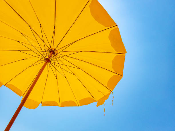 istock Yellow sunshade on a Thailand beach 1144770714