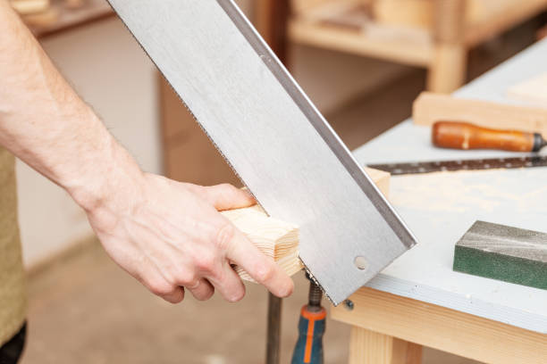 istock Carpenter Working with saw on a construction site. labor safety concept 1144772843
