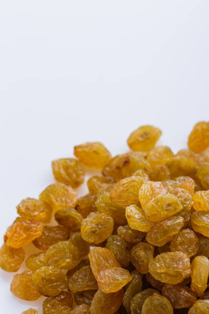 istock golden raisins on a white acrylic background 1144773335