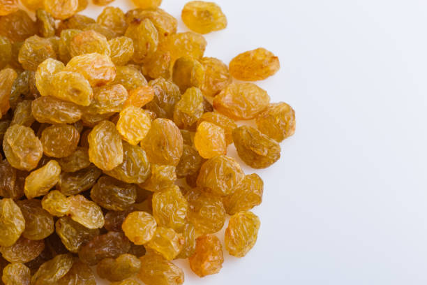 istock golden raisins on a white acrylic background 1144773405