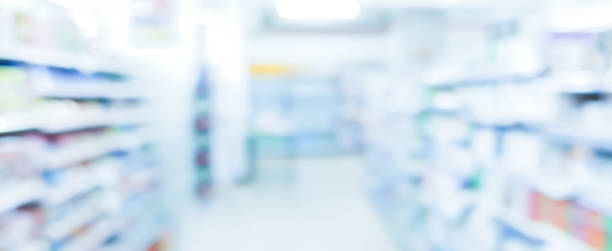 абстрактные размытые аптеки прохода полка распределения фона для медицинской фармацевтической бизнес-концепции - фармацевтической стоковые фото и изображения