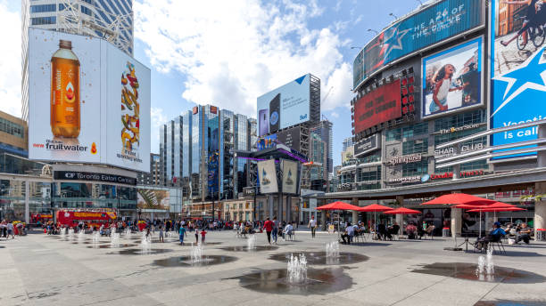 Yonge-Dundas Square in Toronto. Toronto, Canada - May 5th, 2018: Yonge-Dundas Square in Toronto. The Yonge-Dundas intersection is one of the busiest in Canada. toronto dundas square stock pictures, royalty-free photos & images