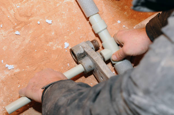 istock Plumber soldering plastic pipes for individual heating system. 1144775712