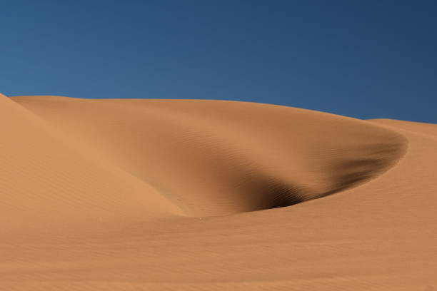 istock hole in the dune under the blue sky 1144775738