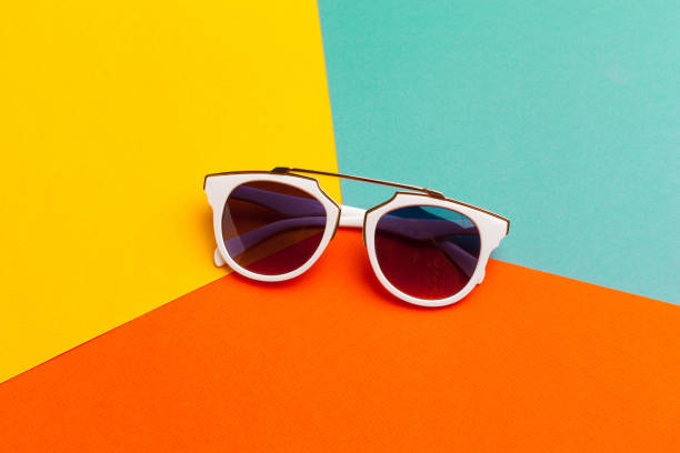 Female sunglasses on a colorful vibrant background Female sunglasses on a colorful vibrant background Bold and eye-catching statement pieces stock pictures, royalty-free photos & images