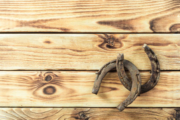 istock old rusty horseshoes on wooden board 1144777819