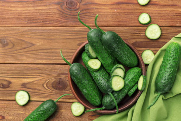 istock Cucumber on wooden background 1144779226