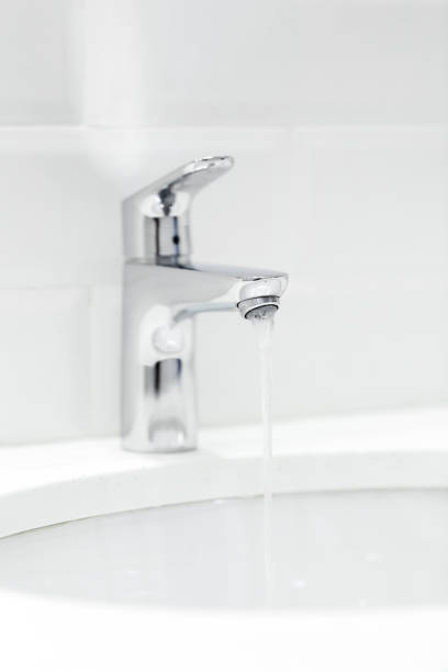 istock chrome crane on the ceramic wash basin in the bathroom close up 1144780372