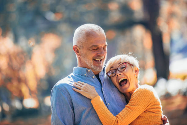 istock Active seniors on a walk in autumn forest 1144783163