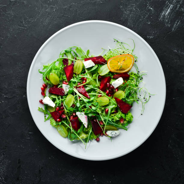 istock Salad. Arugula, blue cheese and beet salad. Top view. 1144783221
