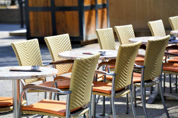 istock tables and chairs in cafe 1144783341