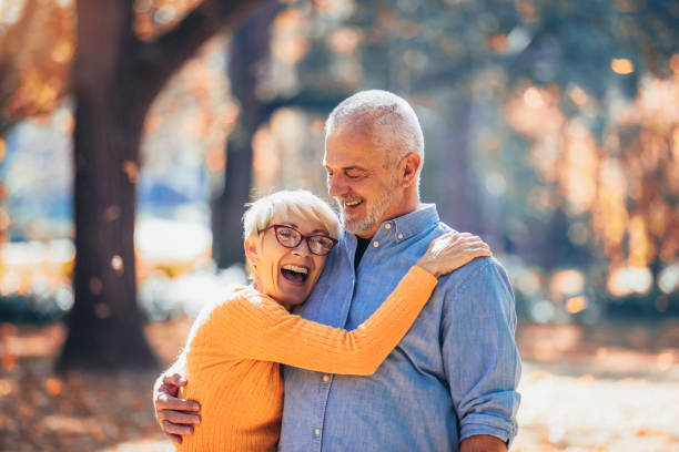 istock Active seniors on a walk in autumn forest 1144784262