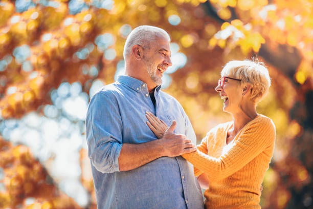 istock Active seniors on a walk in autumn forest 1144784608