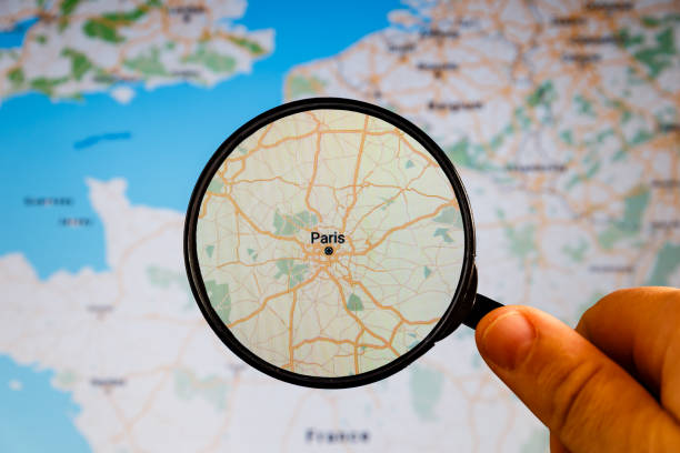 Man using magnifying glass with virtual model map world location point, icon maps and find places in the online system, Connection line over the map, Navigation concept.