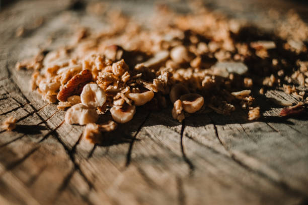 istock cereals, muesli and nuts on a tree trunk 1144785866