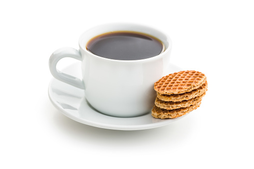 Sweet waffle biscuits and coffee cup isolated on white background.