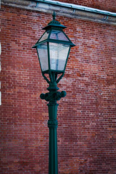 istock vintage lantern on brick wall background 1144786144