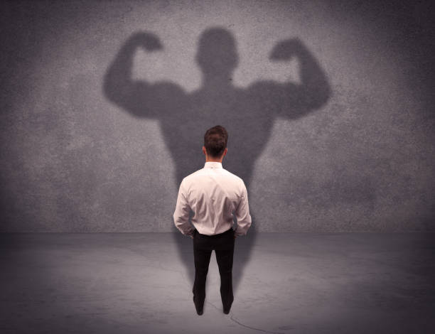 istock Successful businessman with strong shadow 1144787558