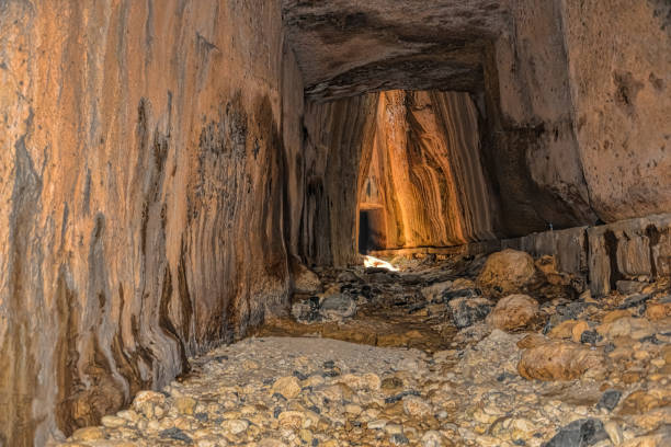 titus tunnels are ancient roman waterways carved into rocks - antakya imagens e fotografias de stock