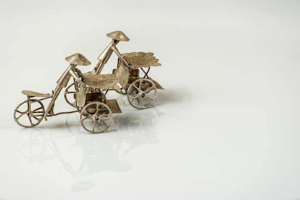 istock Far eastern three wheel bicycle figurines isolated on white back 1144789313