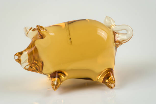 istock Cute glass pig figurine isolated on light background 1144789318