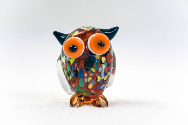 istock Colorful glass owl figurine isolated on white background 1144789326