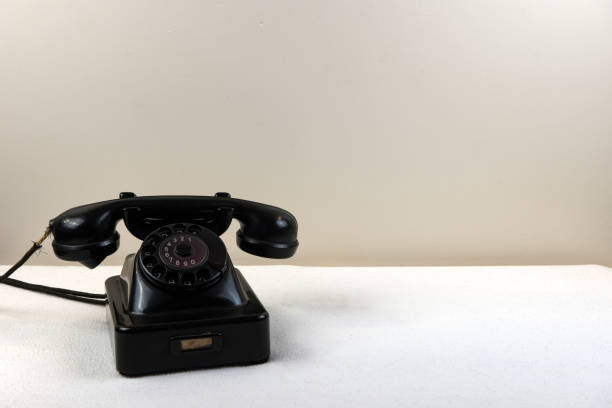 istock Vintage black telephone with classic rotary dial isolated on whi 1144789330