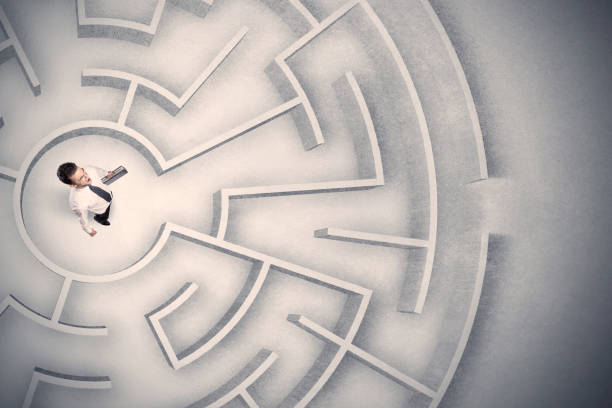 istock Business man trapped in a circular maze 1144789542