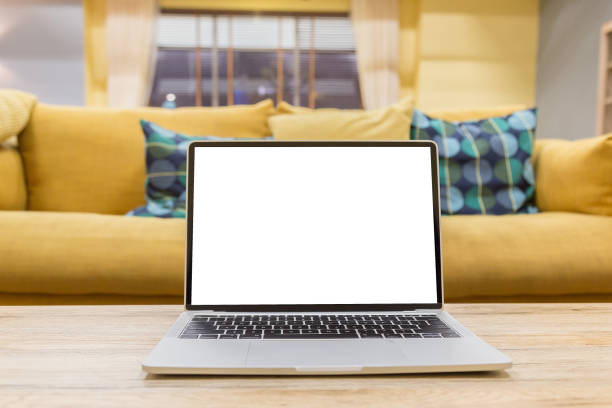 istock Mockup image of a businessman using laptop with blank white desktop screen working in home 1144793063