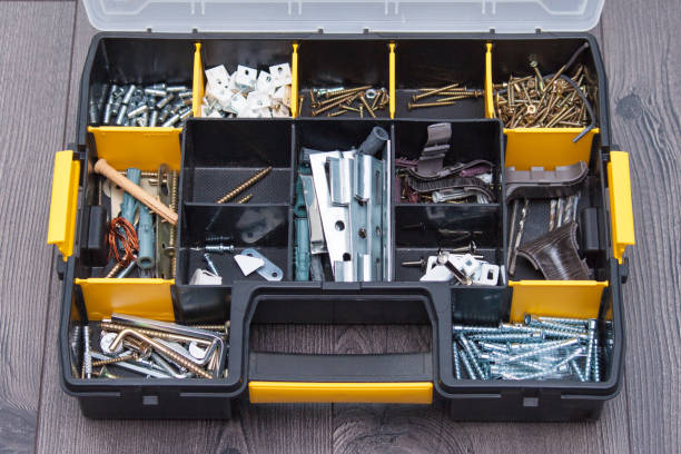 istock Plastic case with hardware items, closeup. Box with nails, screws, bolts, dowels. 1144795322
