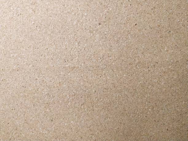 istock Background brown color particle board texture Close up 1144797886