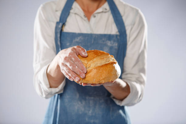 Baker with apron Holding bread