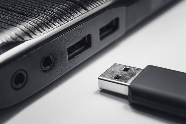 istock inserting usb pen drive on usb port of laptop 1144798737