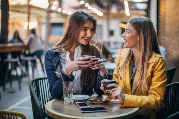 istock Two young women on coffee break in cafe 1144799394