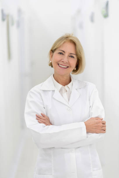 istock Happy dentist at her office looking at the camera smiling 1144800357