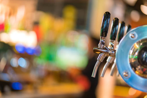 istock beer taps in pub or nightclub. 1144801609