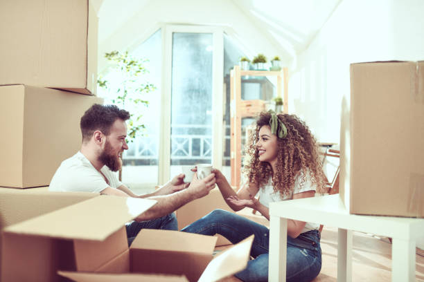 istock Couple Taking A Break From Moving And Drinking Coffee 1144801638