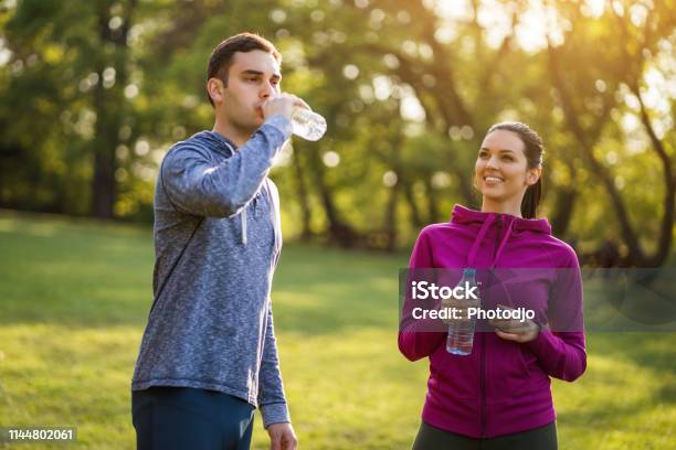 Exercising In Park Stock Photo - Download Image Now - 20-29 Years, Adult, Adults Only