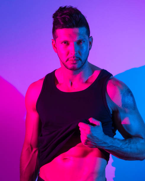 istock Handsome latino man in front of colorful wall 1144803607