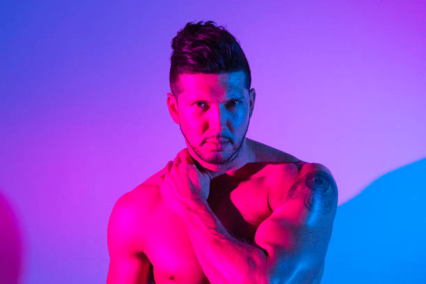 istock Handsome latino man in front of colorful wall 1144803679