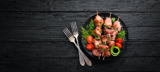 istock Skewers with vegetables. Kebab in a black plate. Top view. Free copy space. 1144803933