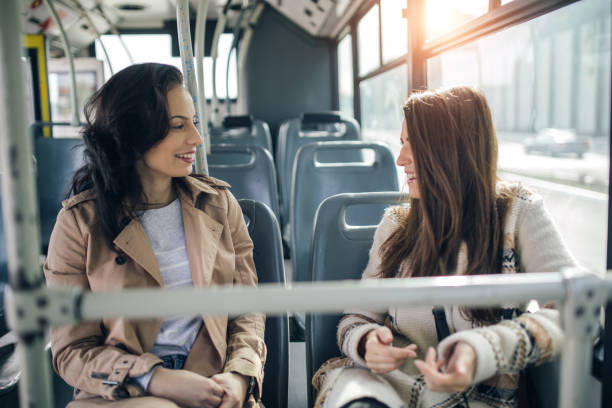 istock Two friends talking in the bus 1144805298
