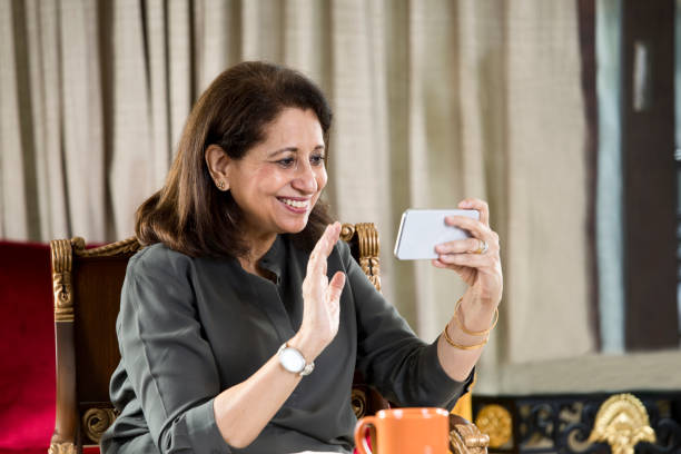 Woman doing video conference using mobile phone