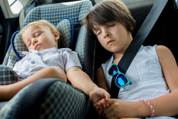 istock Children, sleeping in carseats while traveling 1144805507