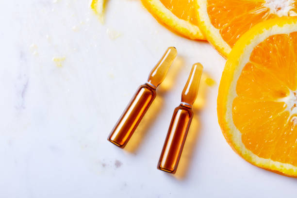 vitamin c concept - vitamin a letter a food orange imagens e fotografias de stock