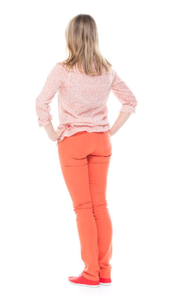 istock Good looking white female standing on white background - hands on hips 1144807254