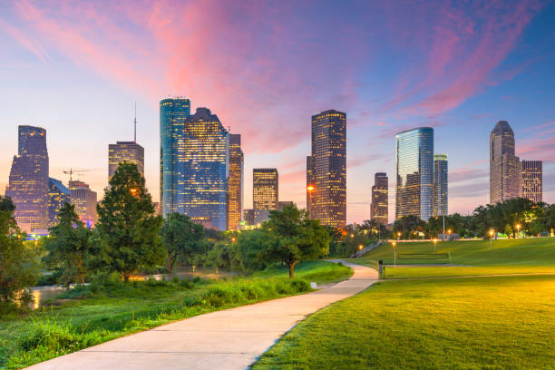 Houston, Texas, USA Houston, Texas, USA downtown city skyline and park at dawn. panorama park stock pictures, royalty-free photos & images