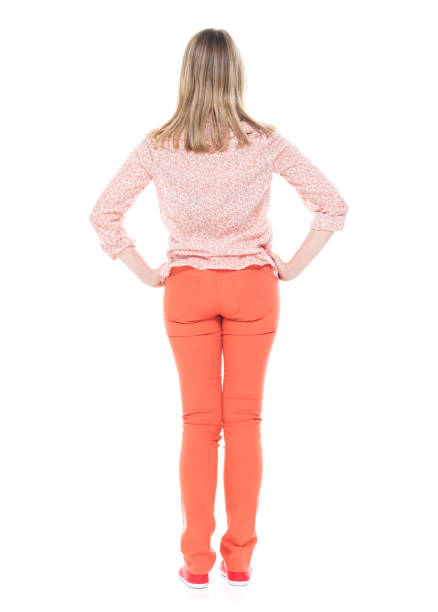 istock Good looking white female standing on white background - hands on hips 1144807548